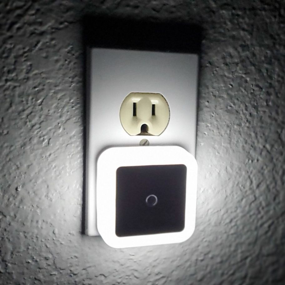 an LED night light plugged in and lit