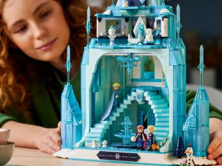 Girl playing with the LEGO Disney Frozen Castle