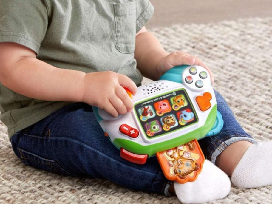 A baby playing with a LeapFrog Controller