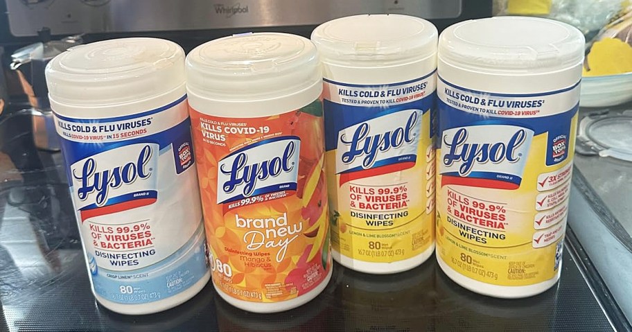 4 large containers of lysol wipes on kitchen stove