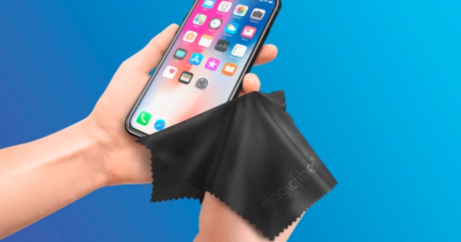 black magicfiber cloth being used to clean iphone screen