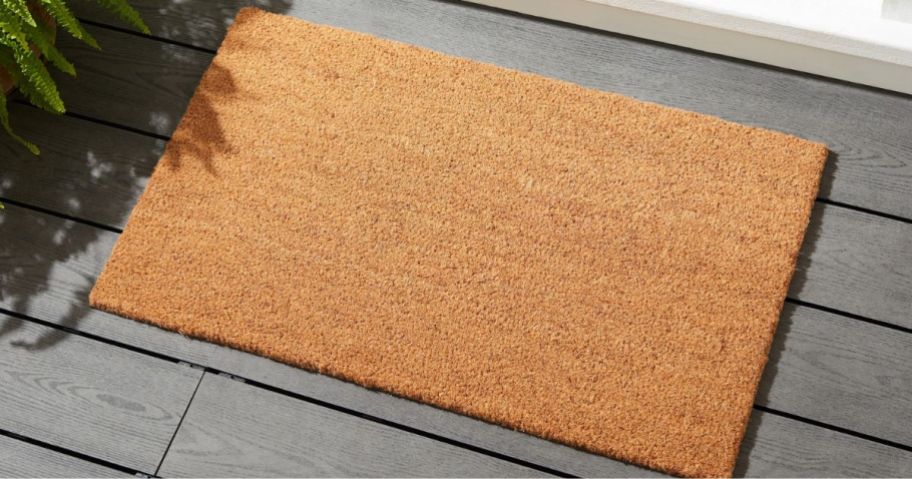 A Mainstays Coir Doormat in front of a door