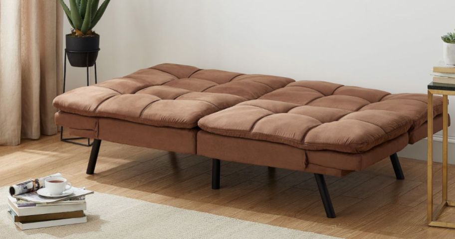 A Mainstays Memory Foam Futon in a living room