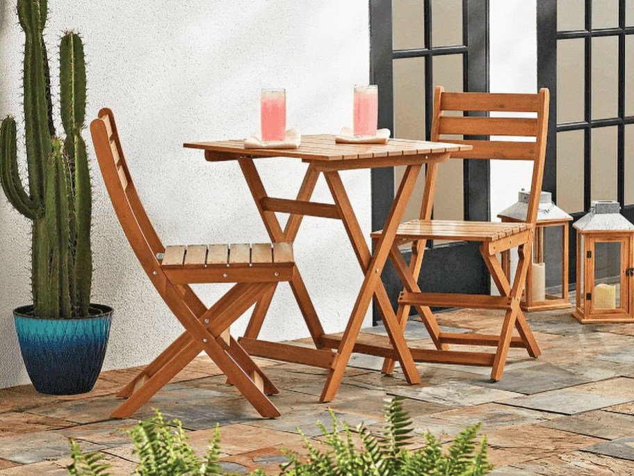 wood bistro chairs and table set on patio