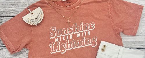 A Sunshine Mixed with Lightning graphic tee from maurices with a pack of earrings and a pair of shorts