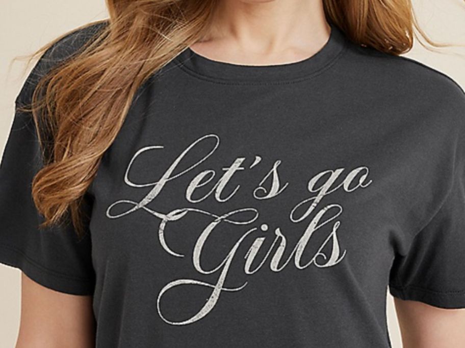woman wearing a Let's Go Girls graphic tee from Maurices