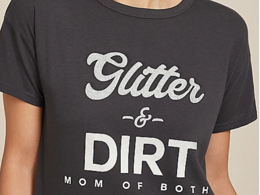 Woman wearing a Glitter & Dirt Mom of Both tee from Maurices
