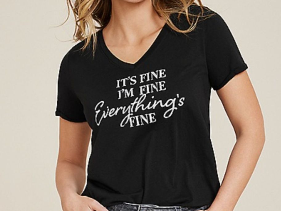 Woman wearing a black graphic tee from Maurices that say's It's Fine, I'm Fine, Everything's Fine