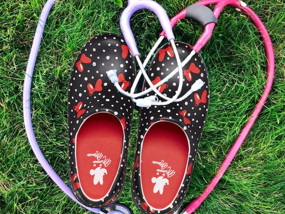 pair of minnie mouse print work crocs surrounded by stethoscopes