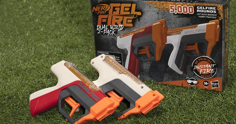 set of nerf guns on grass with their box