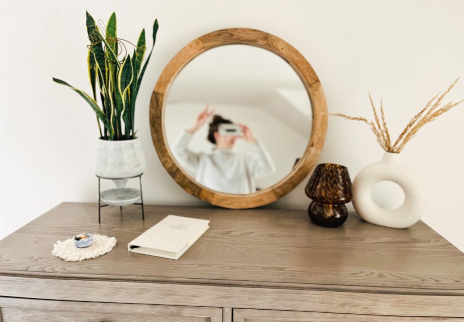 The noble house koda round mirror on a dresser, one of our top picks from the Walmart 2024 Spring Collection