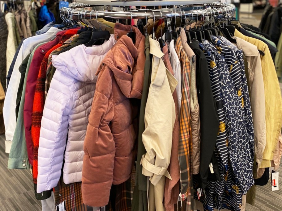 round rack filled with girls coats and jackets
