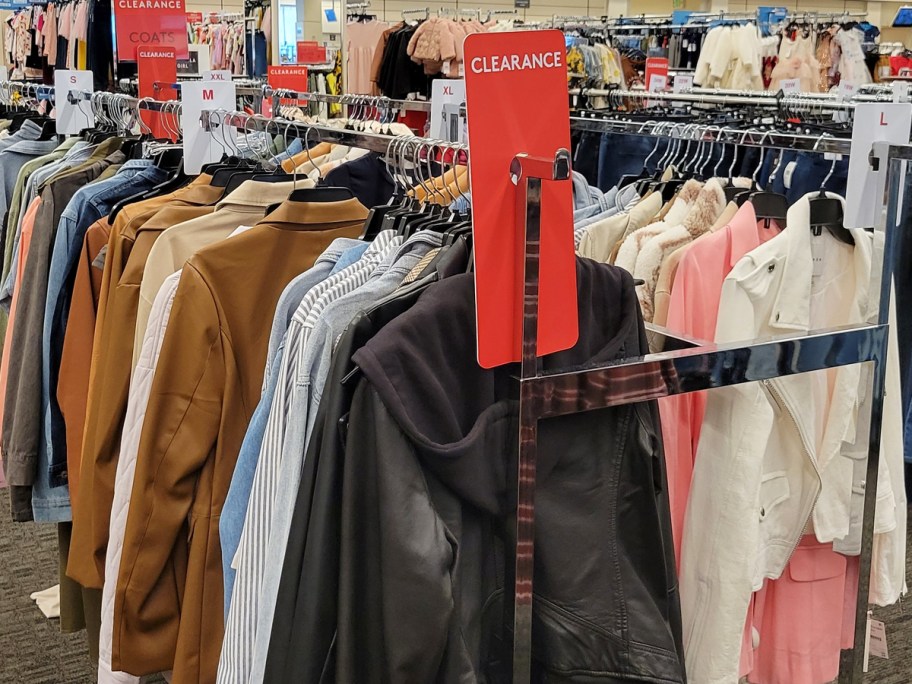 clearance rack of women's jackets and coats in store