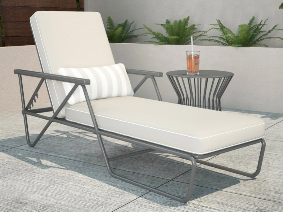 metal chaise lounge with white cushions