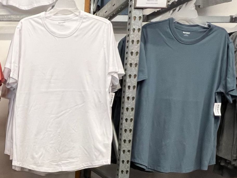 white and gray tee hanging in a store