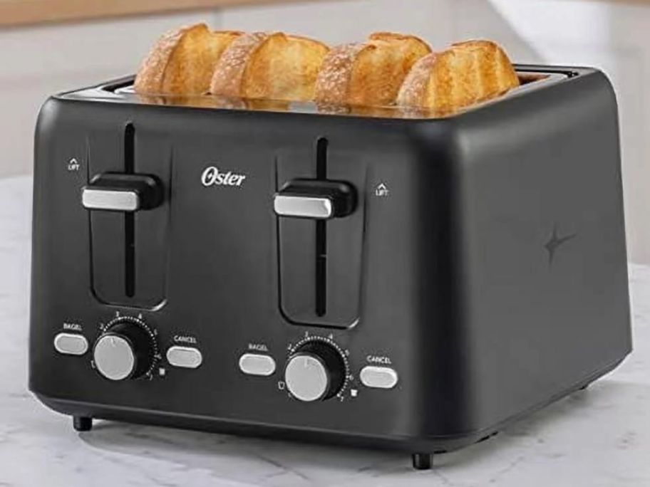 Oster 4-slice Toaster with 4 slices of toast in it