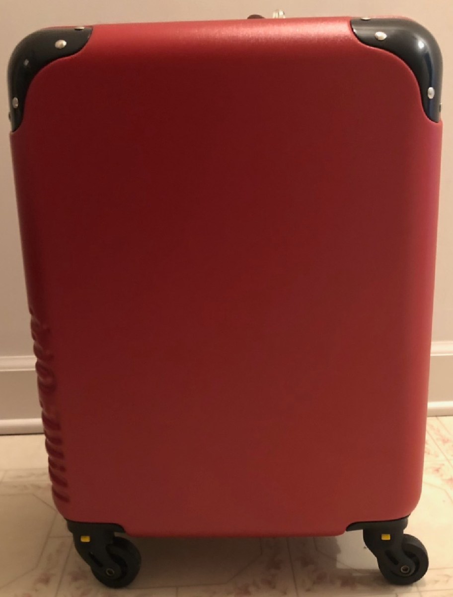 A red suitcase belonging to our Happy Friday reader,. Chris