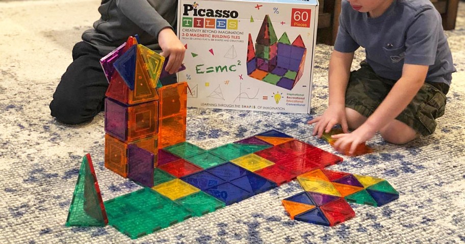 two boys playing with Picasso Tiles on floor