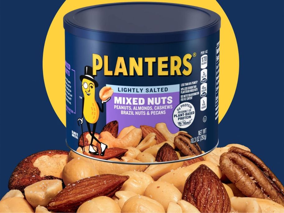 A Planters Lightly Salted canister on top of a mountain of mixed nuts