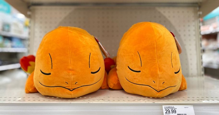 2 Charmander Sleeping pillows on a shelf
