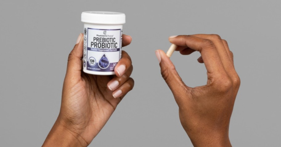 hand holding a bottle of Physician's Choice Prebiotic-Probiotic 