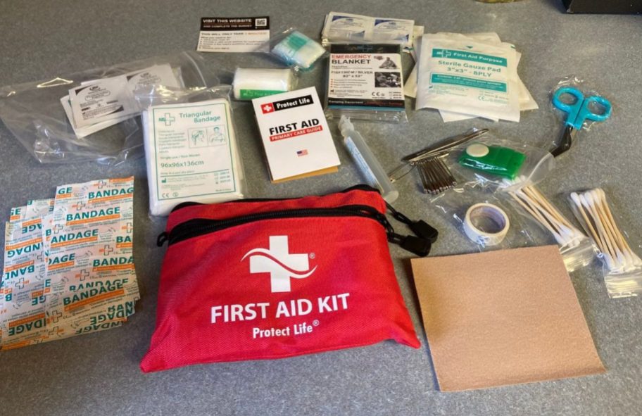 A protect ife first aid kit with the contents laid out around it