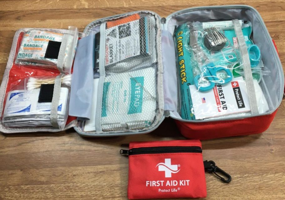 A Protect Life First Aid Kit with a smaller clip pouch next to it
