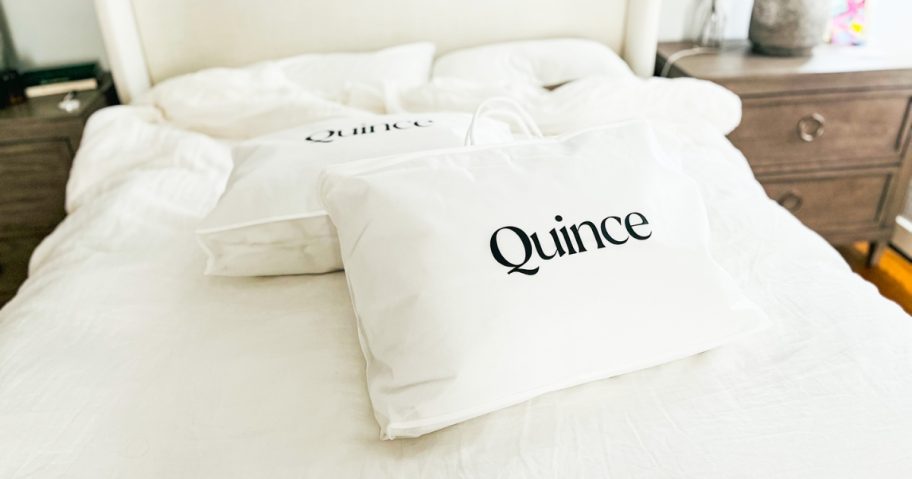 quince bedding in white bags on bed