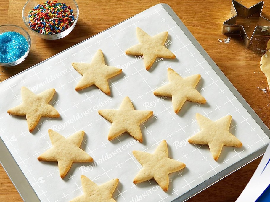 star shaped cookies on parchment paper sheet