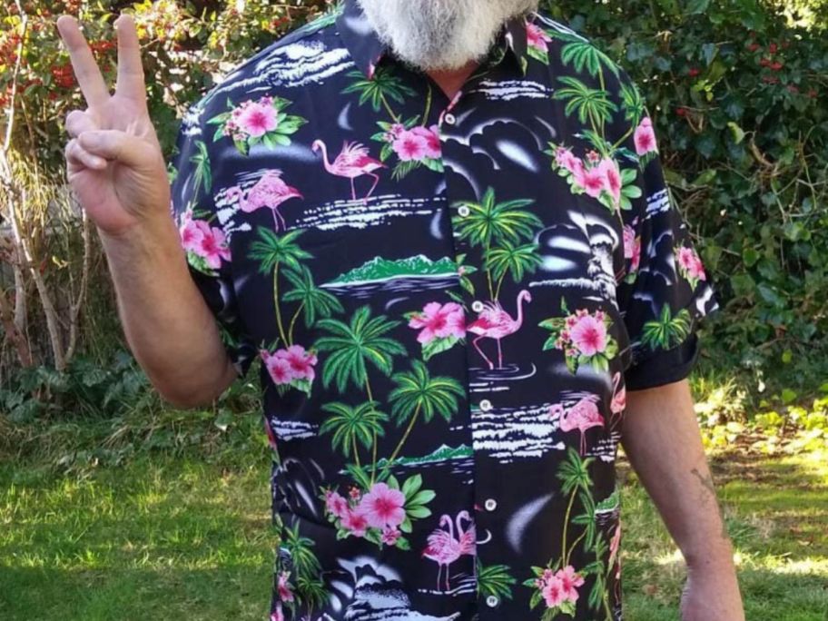A man wearing a Simmashah Men's Hawaiian Shirt Flamingos