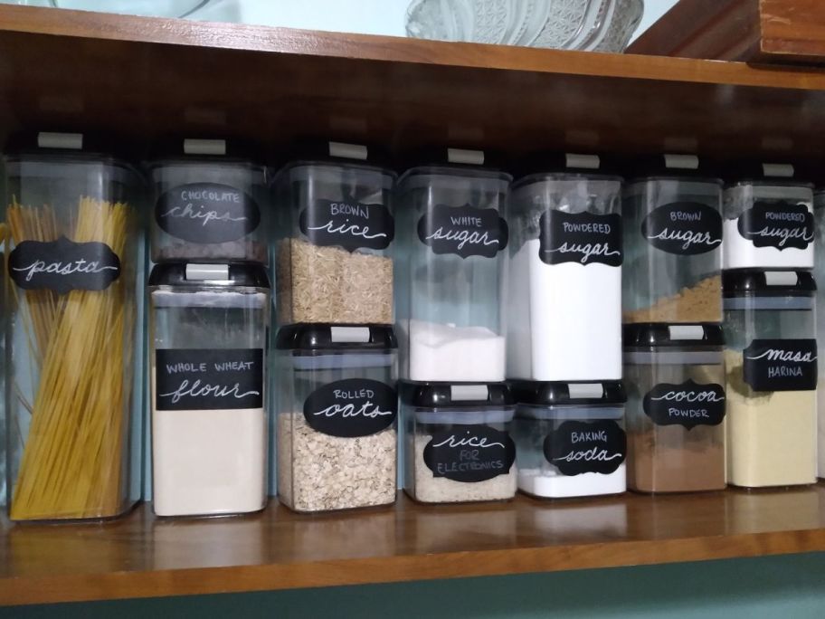 A shelf with Simply Gourmet Food Storage Containers on it