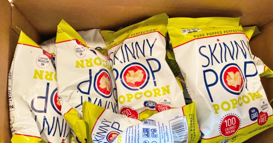 bags of skinnypop popcorn in shipping box