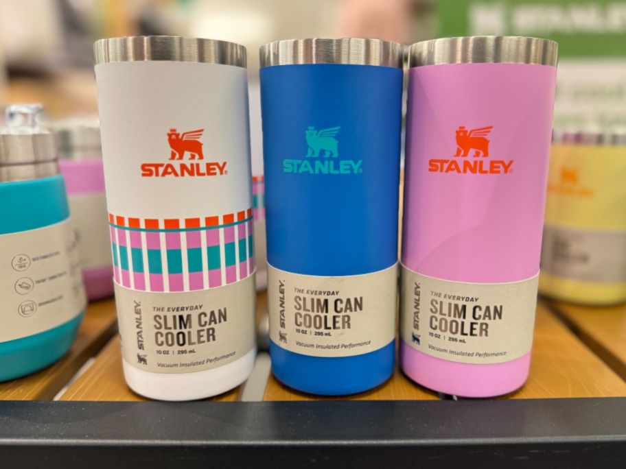 3 Stanley Slim Can Coolers on a table