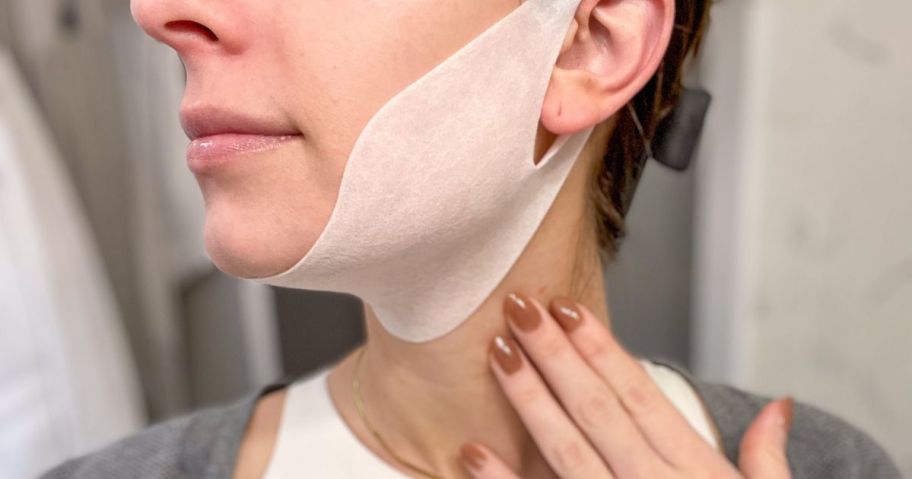 woman's face wearing a white collagen chin lifting mask