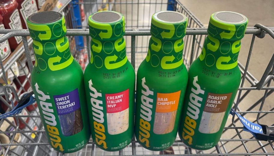four bottles of subway sauce in a shopping cart