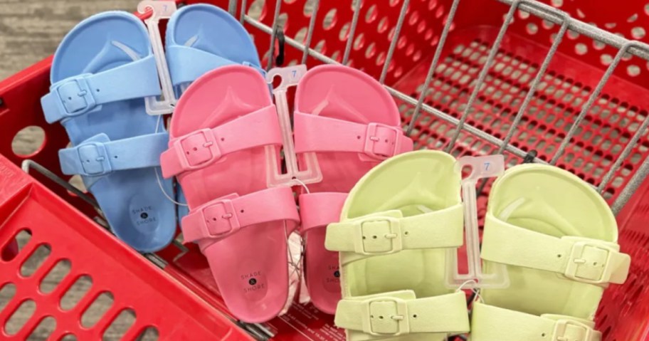 blue, pink and yellow sandals in red cart