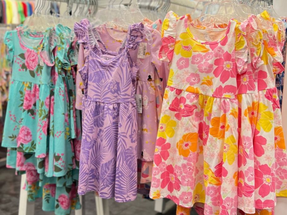 A rack of dresses at The Children's Place