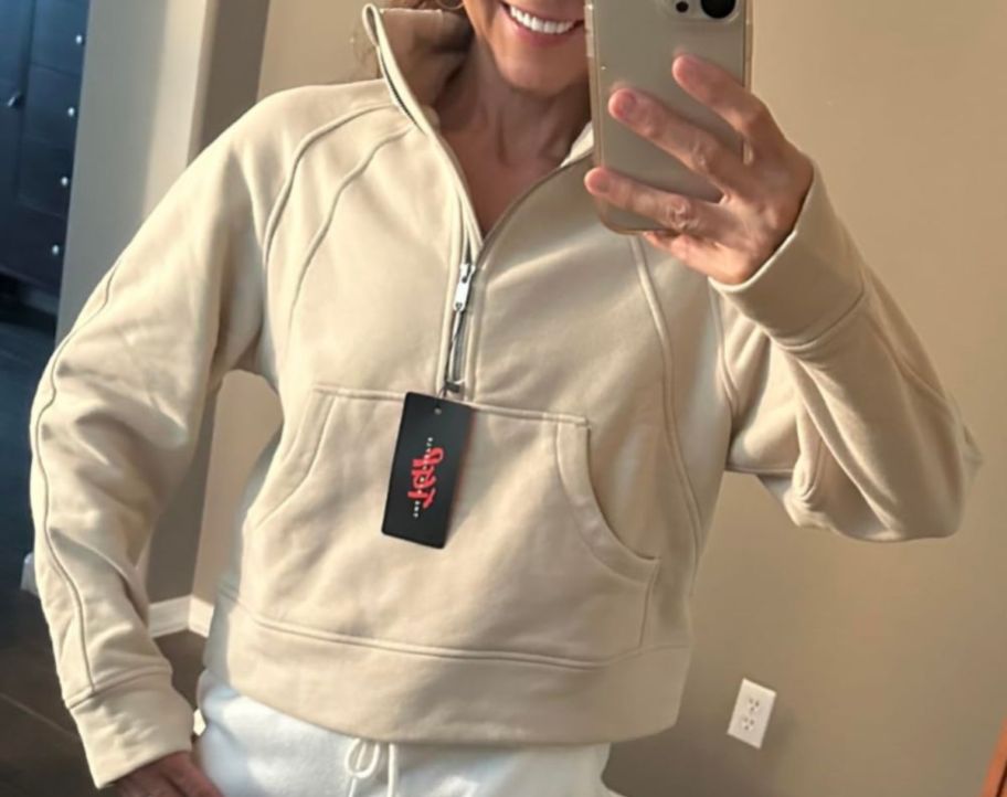 A woman wearing a pullover from The Gym People 