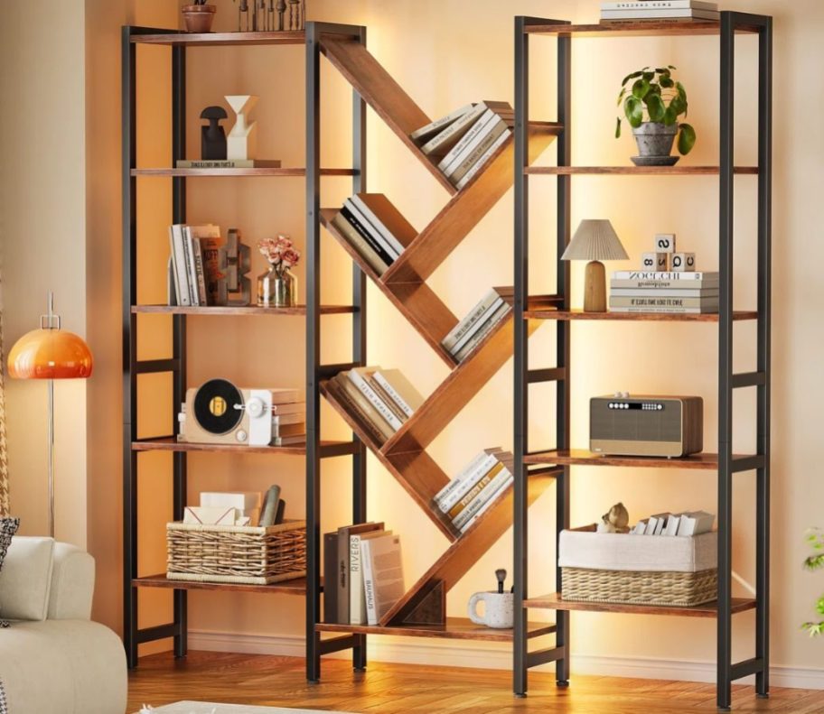 A tree bookshelf with books and decor items on it
