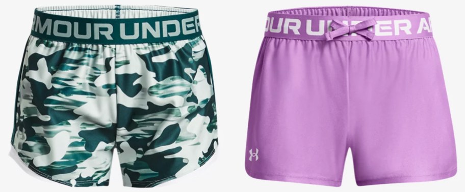green and purple pairs of under armour shorts