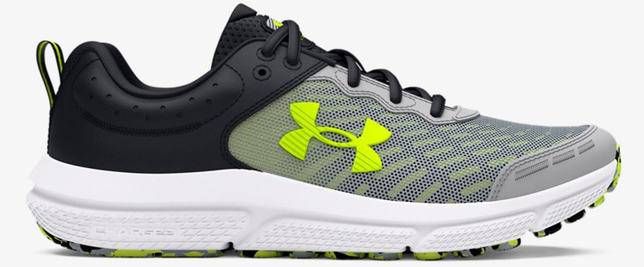 black, grey, and neon yellow under armour running shoe