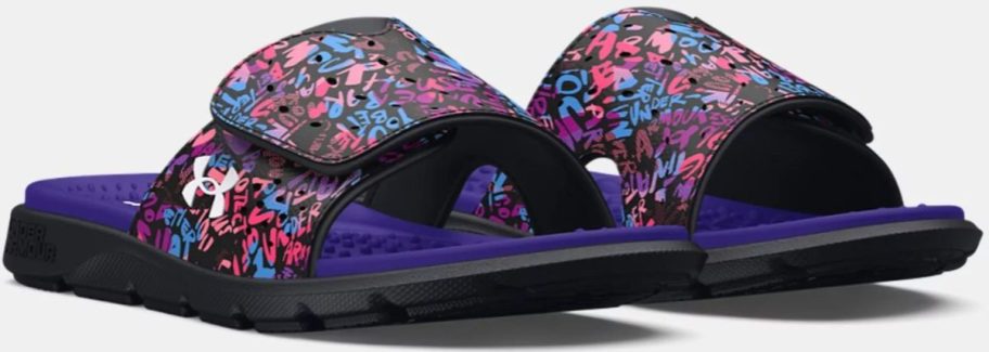 A pair of Under Armour Girls Slides