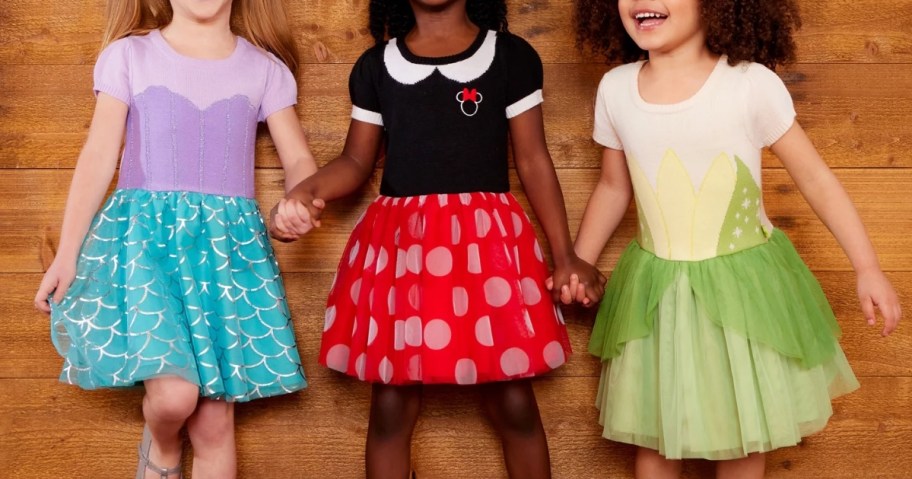little girls wearing Disney Princess and Minnie Mouse dresses