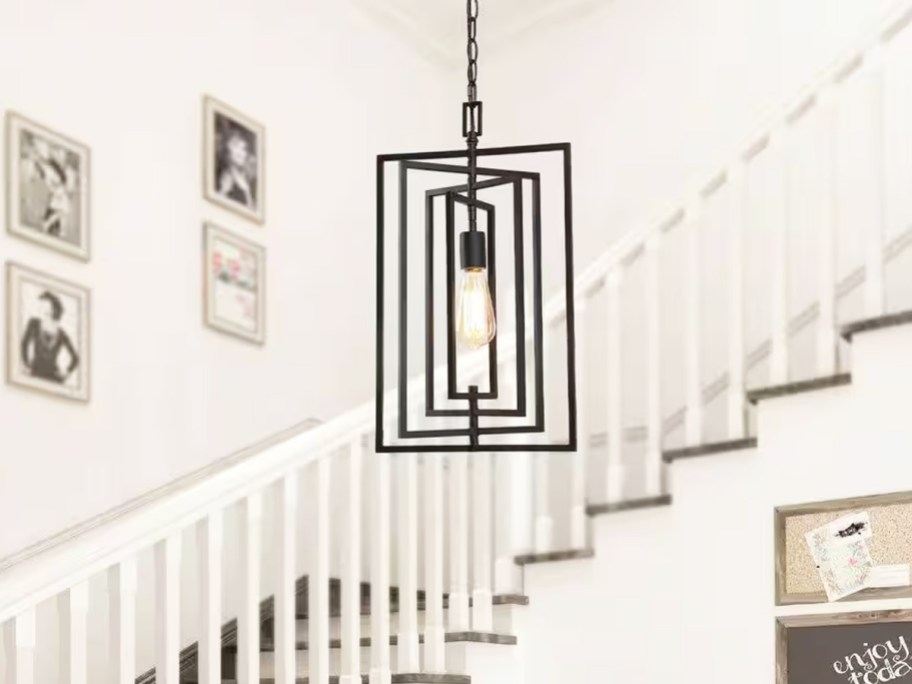 black rectangular pendant light hanging in entryway