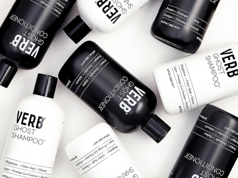 multiple black and white bottles of Verb Ghost Shampoo & Conditioner