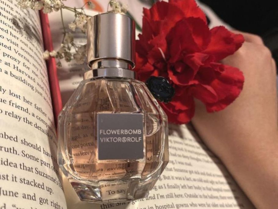 Viktor & Rolf Flowerbomb Eau de Parfum in a book with a flower