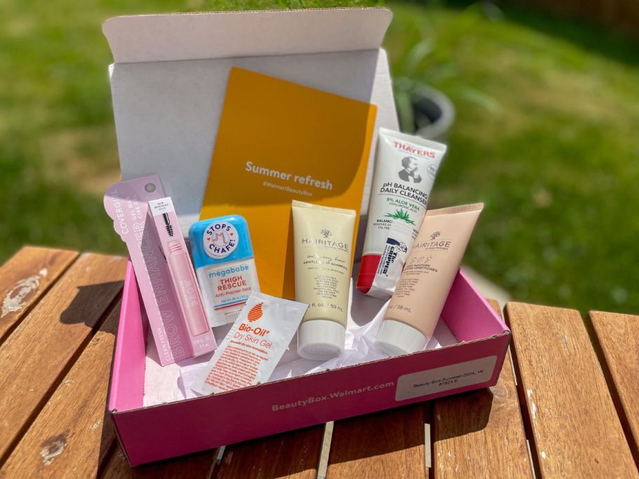 The Walmart Summer Beauty Box on a picnic table