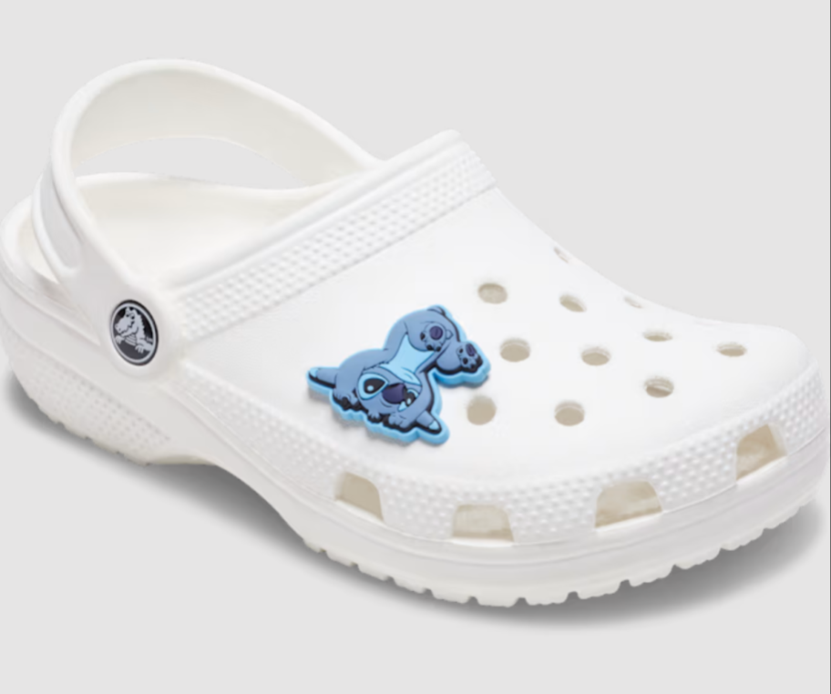 A Stitch jibbitz charm on a crocs shoe