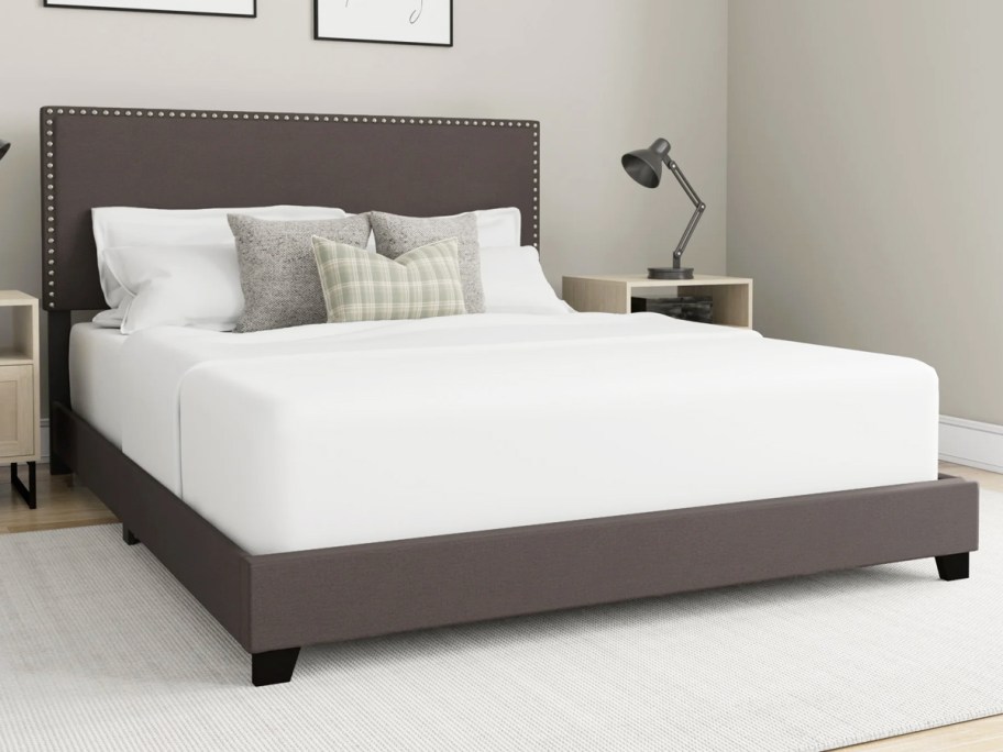 grey upholstered bed frame with matching headboard in bedroom