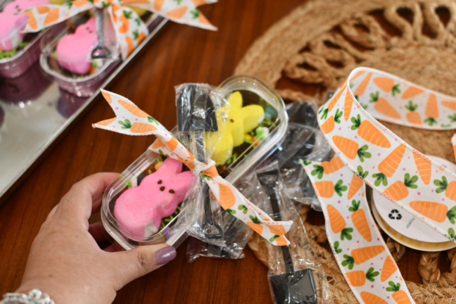 adding ribbon and a shovel spoon to easter dirt cake